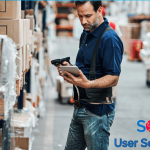 man with scanner and tablet in warehouse