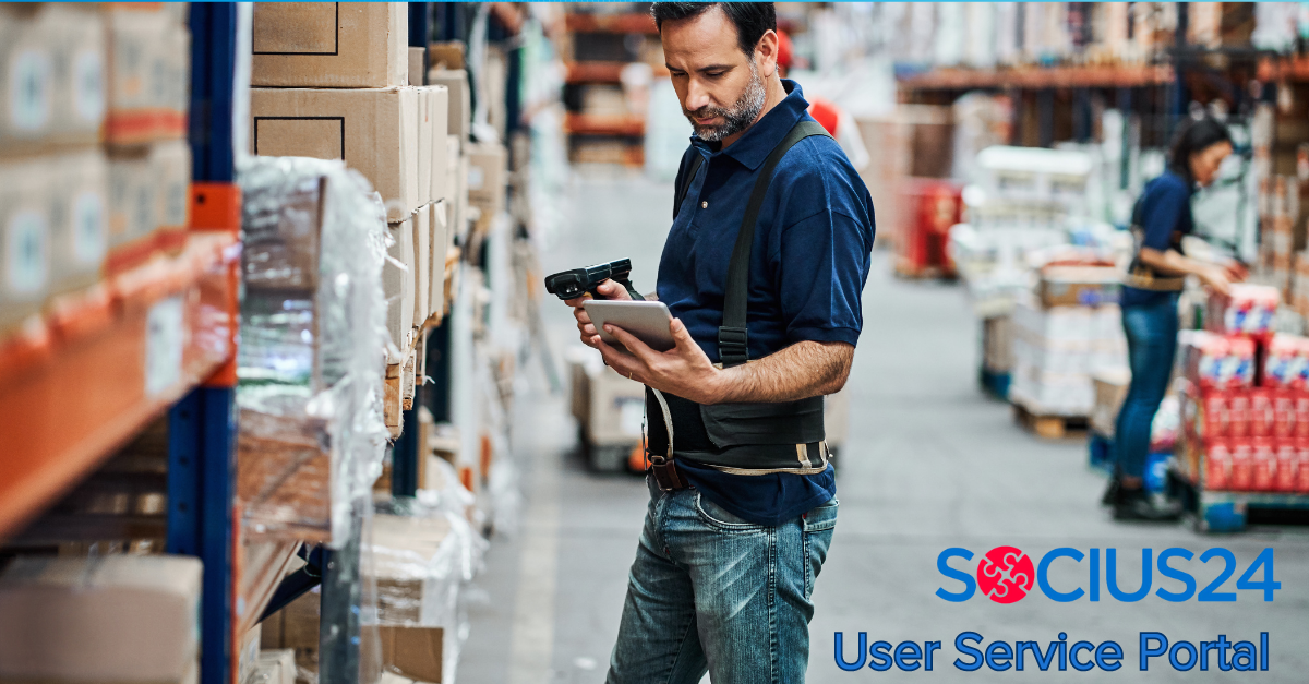 man with scanner and tablet in warehouse