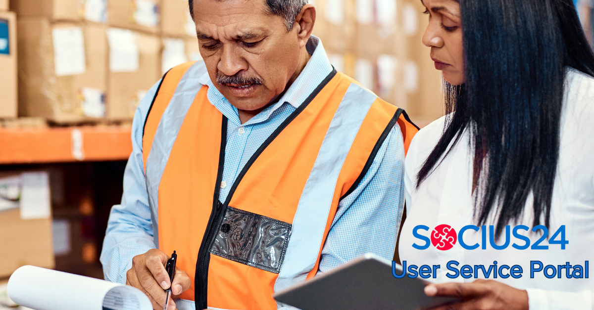 man and woman comparing notes in warehouse