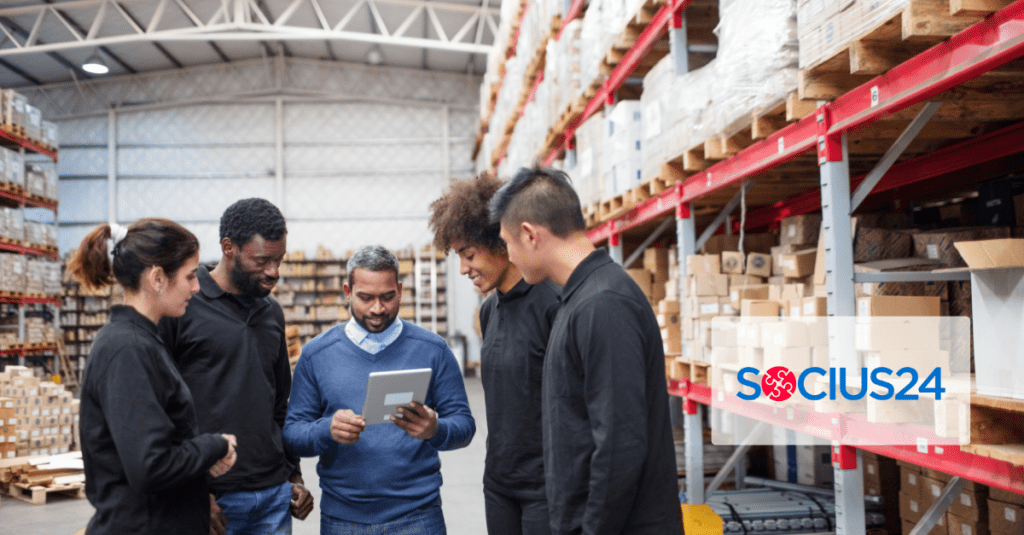 wms5groupstandingaroundtablet Socius24